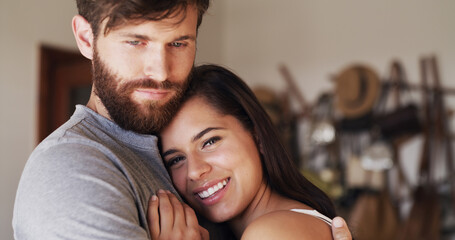 Fototapeta premium Connection, face and hug with couple in home together for comfort, safety or security of relationship. Bonding, portrait and smile of woman on chest of man in apartment for cuddle, love or romance