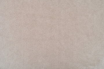 Pale brown fleece fabric texture. Pale brown fabric background of soft and smooth textile material. Fabric texture for design and decoration. Top view. 