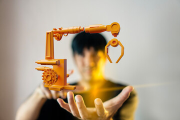 Engineer designing an advanced robotic arm for modern factory automation in the AI era, integrating smart technology for precision manufacturing and industrial efficiency.