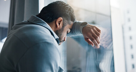 Frustrated, businessman and window with stress for bankruptcy, company liquidation or financial...