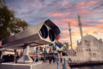 Cityscape View Through Scenic Observation Binoculars at Sunset