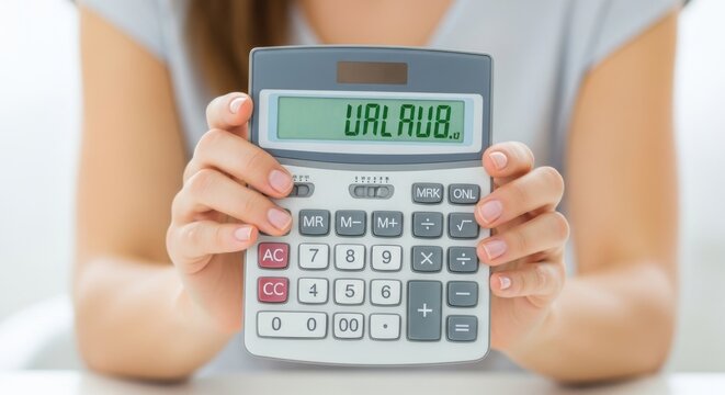 A person holds a calculator with the word urlaub displayed on the screen, suggesting vacation or holiday planning and budgeting