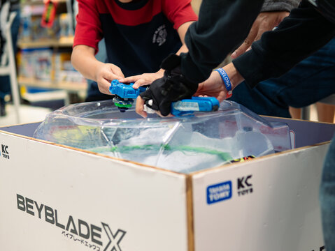Bangkok, Thailand - August 16, 2025 : People participate in Beyblade X, a battling spinning top, weekly competition at a shopping mall.