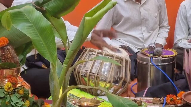 Vastu Puja & Havan purify space, seek blessings via offerings & chants. Kalash embodies divine energy. Tabla & Bhajans elevate ambiance, fostering devotion & inviting positive vibrations.