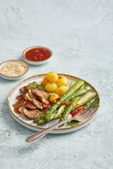 Asparagus with oyster mushrooms and potatoes