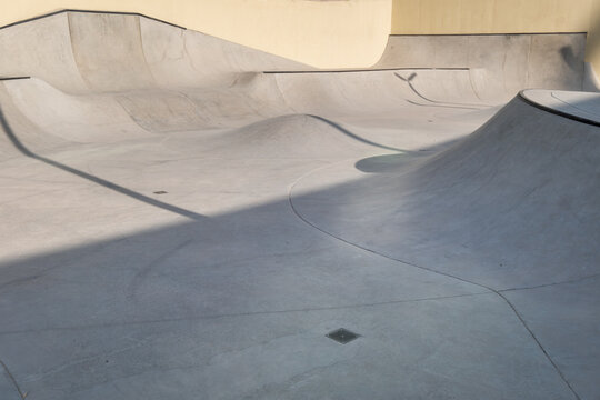 stock photo of Modern outdoor skatepark structure with smooth surfaces