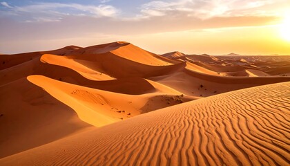 Sunrise over vast desert dunes
