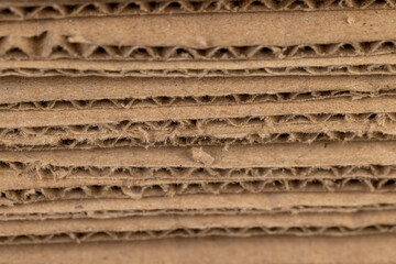 Multilayer cardboard for boxes and other items, stacked large amounts of corrugated cardboard after use in transportation, close up