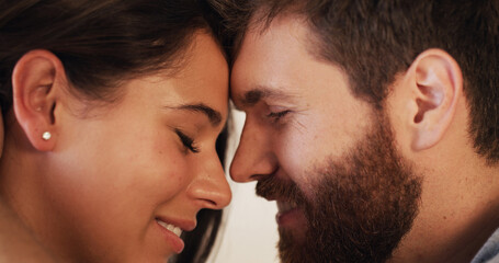 Love, romance and trust with forehead of couple closeup together for connection or safety. Bonding, security or smile with man and woman in moment for honeymoon, marriage anniversary or wellness