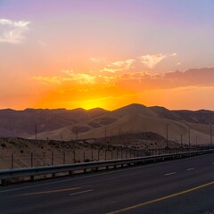 Sunset over desert highway