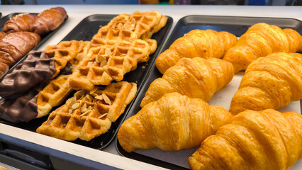 Croffle and Croissant Pastries on Black Tray Bakery Dessert Top View
