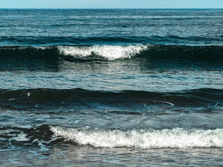 surf waves of clear blue waters of the Arctic Ocean