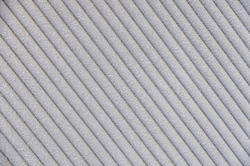 The texture and grain of gray velvet fabric