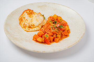 A cozy meal with cheesy baked layers and a vibrant veggie medley, great for sharing