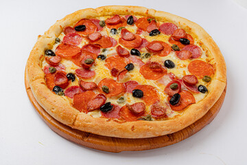A delicious pepperoni pizza showcases its toppings of olives and green peppers, ready to be enjoyed