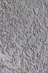 The rugged texture of a mottled wall