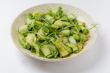 Crisp cucumbers and sweet peas combine with delicate greens in a refreshing summer dish