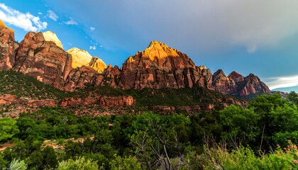 A breathtaking vista of vibrant red rock formations, bathed in the golden hues of a serene sunset, showcasing a lush valley in the foreground.