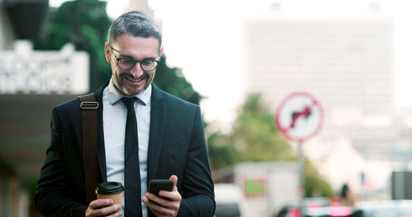 Businessman, phone and happy in city, texting or notification for good news on commute with coffee. Mature person, smile and smartphone with mobile app, drink and social media on road in Argentina