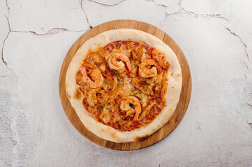 Overhead Shot of a Delicious Shrimp Pizza on Wooden Board