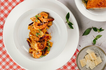 Overhead Shot of Spicy Shrimp Pasta Dish with Chili Flakes and Fresh Basil