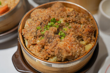 Steamed Potato with Beef in Bamboo Basket – Topped with Fresh Scallions