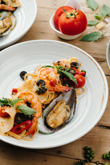 Seafood Spaghetti with Shrimp and Mussels on White Plate