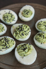 fun halloween green deviled eggs party appetizer close up