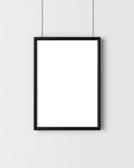 Minimalist black frame hanging on a white wall with subtle shadows