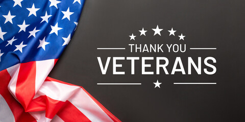 Veterans day. Black background with American flag. Website banner and greeting card design template.