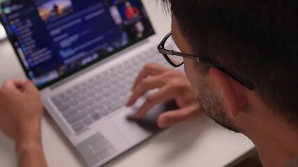 An Individual Deeply Focused on Working with a Laptop while Engaged in Programming Tasks AI and deep learning. Neural network model and diagram. Businessman using laptop computer to train AI.