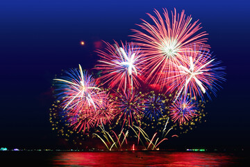 Colorful fireworks celebration and the midnightblue sky background.