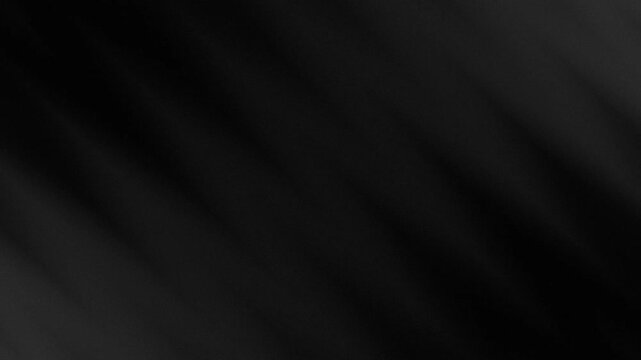 Completely black and blurred shaded glass background for abstract or mysterious concepts, ideal for overlay text or design projects.