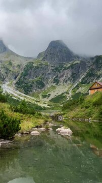 Scenic view of mountain lake and hut (Chata pri zelenom plese) in High Tatras, Slovakia.  Zelene Pleso (Green lake) mountain lake in High Tatras, Slovakia