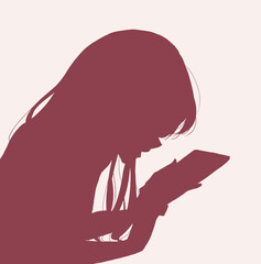 うつ伏せでスマホを触る女性　シルエット