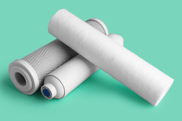 New water filter cartridges on green background
