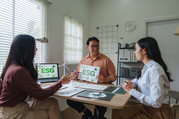 Fototapeta premium Group of managers discussing environmental, social, and governance - esg - policies in meeting