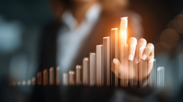Business growth concept with hand pointing at rising graph, symbolizing success and progress in financial performance. image conveys motivation and ambition