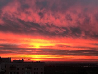 Dramatic Red and Orange Sunset Sky Over City Skyline