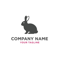 Silhouette of a dark grey rabbit sitting upright, with 
