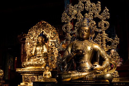 Golden bodhisattva statue with ornaments