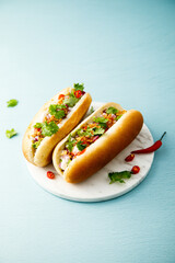Hot dogs with red pepper and cilantro