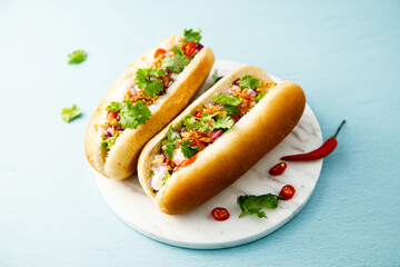 Hot dogs with red pepper and cilantro