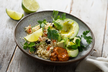Couscous bowl with avocado and pepper sauce