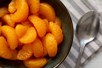 Organic Canned Mandarin Oranges in Bowls, top view. Close-up.