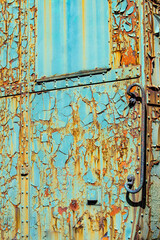 Peeling paint on an old railway carriage with rust