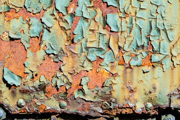 Peeling paint on an old railway carriage with rust