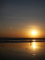 Bali’s sunset displays vibrant colors over the ocean, creating unforgettable, peaceful, and romantic moments daily.