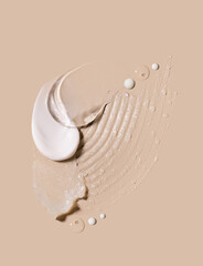 composition of smears of cream gel texture on a beige background