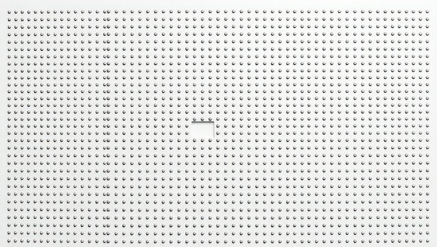 A white surface covered in evenly spaced holes with a small square cut out in the middle section